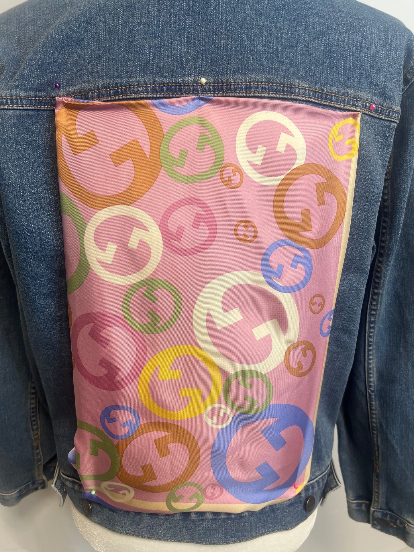 Colorful Monogram  on blue denim jacket.